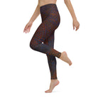 Girl in photo cut off from the waist up, with her leg kicked up, against a white background, wearing Salt Skins Black Flat Front Yoga and Workout Pants.